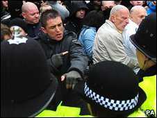 Police have clashed with members of the English Defence League during a protest in Nottingham, with 11 people arrested. Some 300 demonstrators from the EDL marched through the city centre...