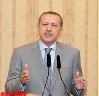 Turkish Prime Minister Recep Tayyip Erdogan has said that nobody shall expect Turkish security forces to lay down arms, Anadolu Agency reported. Erdogan replied questions of reporters after he performed...