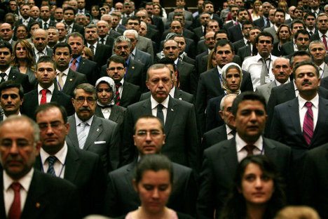 Turkey’s Prime Minister Tayyip Erdogan (3rd row centre) stands next to Justice and Development Party (AKP) members during a meeting at the party headquarters in Ankara in September. ADEM ALTAN/AFP/GETTY...