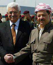 Mahmud Abbas (L) shakes hands with Massud Barzani