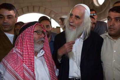 Rabbis visit torched mosque, condemn attack