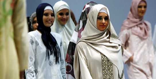 Models present creations for Muslim women during an Islamic Fashion Fair in Istanbul April 11, 2010. From a simple headcovering, stigmatised in the early days of the Turkish Republic as backward and rural, the headscarf has become, in the last decades, a carefully crafted garment and highly marketable commodity, embodying the challenge of a new class of conservative Muslims to Turkey's secularist elites. -Reuters Photo