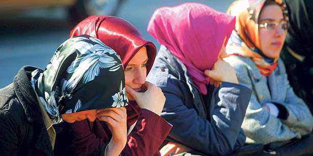 A group of students are seen in a February 2008 file photo sitting outside Marmara University as they were not allowed to go on campus despite a decision to lift the ban.