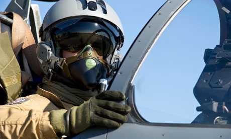 A French pilot aboard a Mirage jet fighter in Corsica prior to taking off for a mission to Libya. Photograph: Anthony Jeuland/AP