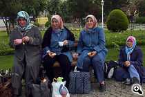 Women take a tea and breakfast break in Sultanahmet Square while visiting Istanbul. Turkish women's groups are united behind an initiative to place women who wear headscarves high enough on electoral lists to be chosen in the upcoming Turkish parliamentary elections. (Photo: Dean C.K. Cox) 