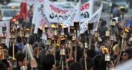 yerevan-genocide-protests People carry torches during a rally through the streets of Yerevan