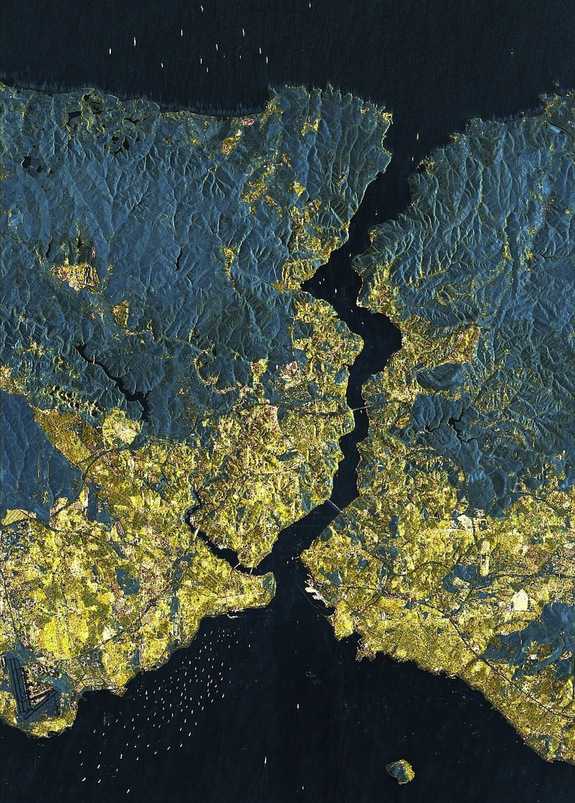 A German satellite image provides a detailed view of Istanbul from more than 300 miles (500 kilometers) up. There is dense housing where yellow is predominates. In the city itself, only a few areas remain undeveloped and are thus shown in green. CREDIT: DLR