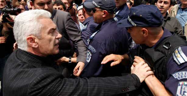 Nationalist party ATAKA leader Volen Siderov argues with a riot policeman as his supporters protest in front of Banya Bashi Mosque in Sofia during the Friday noon prayer on May 20, 2011. Supporters of ATAKA party and Turkish Muslims entered into clashes outside the mosque during a rally of the nationalists against the loudspeakers of the mosque, seriously injuring one Muslim.