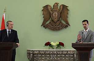bashar_erdogan_0429 Syrian President Bashar al-Assad (R) speaks during a joint press conference with Turkish Prime Minister Recep Tayyip Erdogan at al-Shaab palace in Damascus on October 11, 2010. Louai Beshara / AFP / Getty Images Read more: