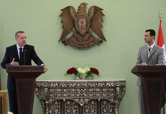 Syrian President Bashar Assad, right, listens as Turkish Prime Minister Recep Tayyip Erdogan speaks during a joint press conference in Damascus on Oct. 11, 2010  Read more: 