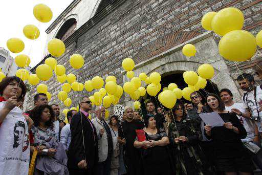Artists and Amnesty International activists hold ballons to release in support of prisoners of conscience during a demonstration in the Istancool Istanbul International Festival of Culture in Istanbul May 29 (Reuters)