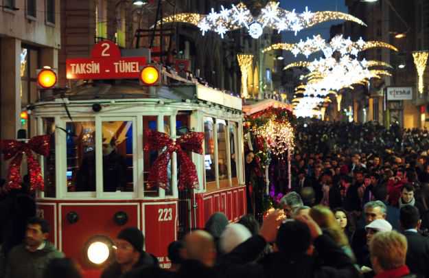 A tram runs along Istiklal Street decora