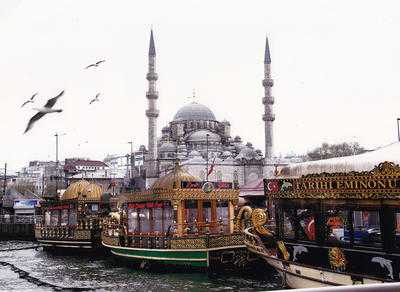 nmij0614beth Arty Boats tied up at Eminonu on the Bosphorus with Mosque in the background. Minarets were...