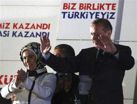 Turkish Prime Minister Recep Tayyip Erdogan addresses his supporters gathered in front of his Justice and Development Party headquarters in Ankara, Turkey, late Sunday, June 12, 2011.