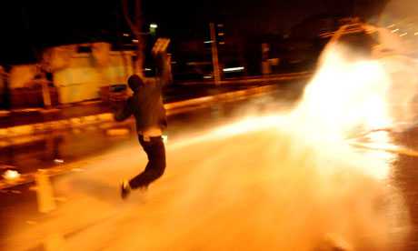 A Kurd throws a molotov coktail during a clash with riot police in Istanbul on the anniversary of the capture of Abdullah Ocalan. Photograph: Bulent Kilic/AFP/Getty Images