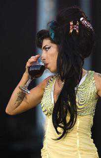 FILE - In this July 4, 2008 file photo, jazz soul singer Amy Winehouse, from England, performs during the Rock in Rio music festival in Arganda del Rey, on the outskirts of Madrid. Amy Winehouse was booed and jeered late Saturday, June 18, 2011 during a concert in Serbia's capital as she stumbled onto the stage, mumbled through her songs and wandered off. (AP Photo/Victor R. Caivano, File) EDITORIAL USE ONLY