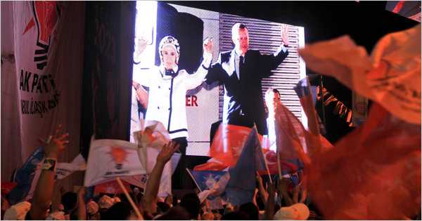 Thanassis Stavrakis/Associated Press  Supporters in Ankara cheered screen images of Prime Minister Recep Tayyip Erdogan and his wife, Emine, on Sunday. 