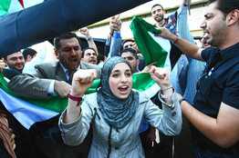 Agence France-Presse/Getty Images  Activists chanted slogans against Syrian President Bashar al-Assad after a meeting of opposition groups in Antalya, Turkey on Thursday.