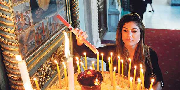 A member of Turkey’s Greek Orthodox community in an İstanbul church. Non-Muslims demand equality for minorities in the new constitution.