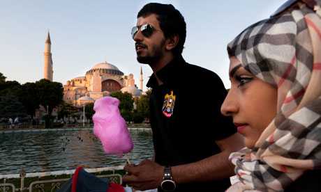 Muhammad al-Menhali and wife Imad from Abu Dhabi who normally go to Egypt, enjoy their first trip to Turkey where they say they ‘feel safer’. Photograph: Jonathan Lewis