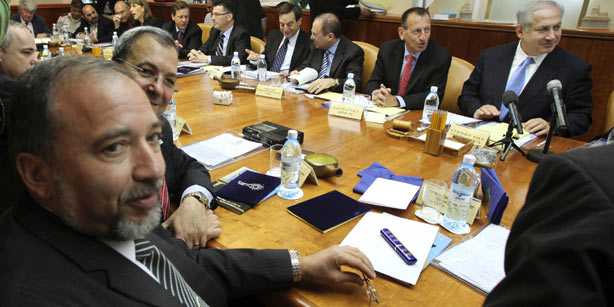 Israeli Foriegn Minister Avigdor Lieberman (L) and Defense Minister Ehud Barak (2nd from L) attend the weekly cabinet meeting chaired by Prime Minister Benjamin Netanyahu (R).