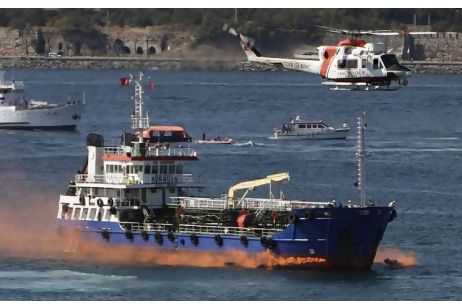 A Turkish Coast Guard helicopter flies over an oil tanker during a National marine pollution emergency response exercises in the Bosphorus yesterday. Osman Orsal / Reuters