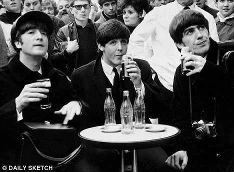 The Beatles drinking coca cola