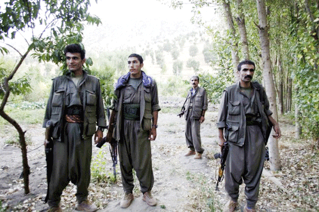 PKK fighters stand near the Qandil mountains near the Iraq-Turkish border in Sulaimaniya, 330 km (205 miles) northeast of Baghdad, September 30, 2010.