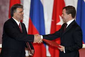 Turkish President Abdullah Gul (left) greets Russian President Dmitry Medvedev. Turkey-Russia economic relations are a key component of bilateral ties. [Reuters]