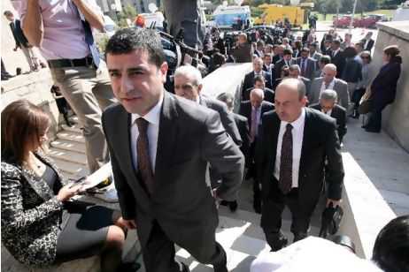 The newly elected MPs of the pro-Kurdish Peace and Democracy Party and its chairman, Selahattin Demirtas, (foreground) seen arriving outside the parliamentary building in Ankara as they ended a four-month boycott of the Turkish parliament. ADEM ALTAN / AFP PHOTO