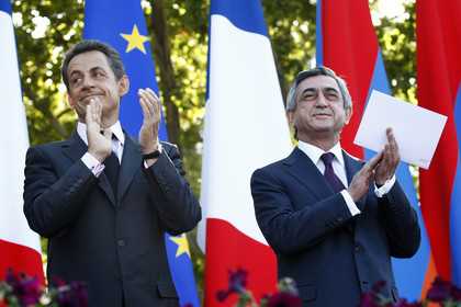 AP Photo/PanARMENIAN, Tigran MehrabyanFrench President Nicolas Sarkozy, left, and Armenian President Serge Sarkisian applaud at the French Square, in Yerevan, Armenia, Friday, Oct. 7, 2011. Sarkozy has urged Turkey to recognize the 1915 massacre of Armenians by Ottoman Turks as genocide. Sarkozy said Friday during a news conference in the Armenian capital that Turkey's refusal to do so would force France to change its law and make such denial a criminal offense.YEREVAN, Armenia (AP) — French President Nicolas Sarkozy has urged Turkey to recognize the 1915 massacre of Armenians by Ottoman Turks as genocide.Sarkozy told Friday's news conference in the Armenian capital 