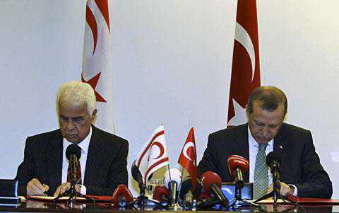 Turkish PM Recep Tayyip Erdogan and Turkish Cypriot Leader Dervish Eroglu (L) attend a signing ceremony in New York on September 21, 2011 for a deal for offshore gas exploration in the Mediterranean