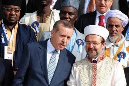 Turkish Prime Minister Recep Tayyip Erdogan, front left, speaks with Mehmet Gormez, head of Turkey's Religious Affairs Directorate, after a meeting with African Muslim religious leaders in Istanbul, Turkey, Monday, Nov. 21. 2011.