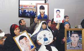Tunisian families displaying photos of victims watch on TV screens the trial of former Tunisian Director General of National Security Adel Tiouiri, the former commander of the National Guard, Mohamed Lamine Abed and the former director general of the intervention brigade, Jalel Boudriga last week in Tunis. Former Interior Minister Rafik Haj Kacem and his staff are on trial on charges of either ordering or having shot and killed demonstrators during the December 2010 and January 2011 uprising
