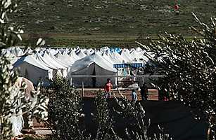 intl_syria_turkey_0308 Syrian children play soccer inside a refugee camp in Reyhanli, Turkey, on March 4, 2012 Gaia Anderson / AP Read more:
