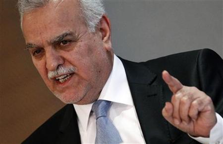 Iraq's fugitive Vice President Tareq al-Hashemi gestures as he addresses the media in Ankara