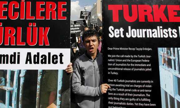 Journalists and activists participate in a rally calling for press freedom in central Ankara