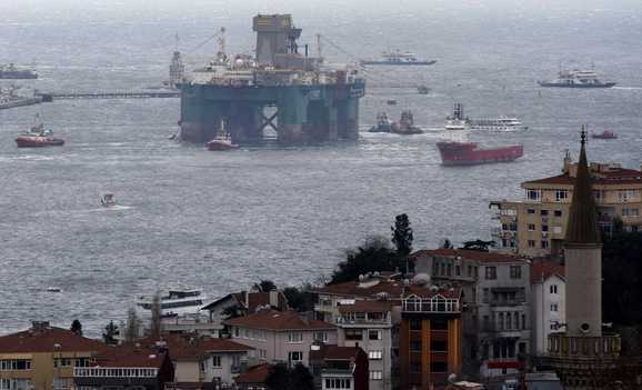 The Leiv Eiriksson, an oil drilling platform, is escorted by tugboats as it enters the Bosphorus in Istanbul