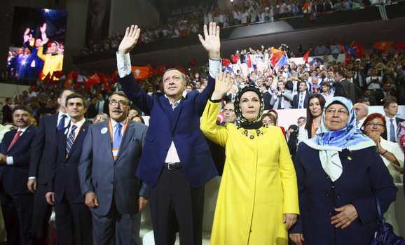 Turkey's Prime Minister and leader of ruling Justice and Development Party (AKP) Recep Tayyip Erdogan (C), accompanied by his wife, Emine, (front 2nd R), greets his supporters as he enters the hall during his party congress in Ankara, Sept. 30, 2012. (photo by REUTERS/Adem Altan/Pool ) Read more: http://www.al-monitor.com/pulse/originals/2013/03/religion-turkey-akp-islamists-zaman-gulen-dagi.html#ixzz2NsQO1Dt0