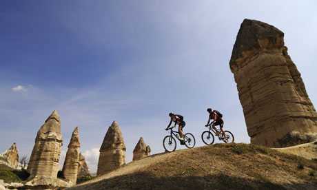 Mountainbiker in the Love Valley, Guevercinlik valley, Cappadocia, Turkey