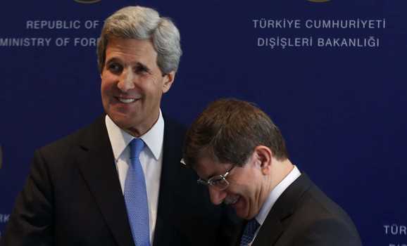 U.S. Secretary of State Kerry  and Turkey's Foreign Minister Davutoglu leave after a joint news conference at Ciragan Palace in Istanbul