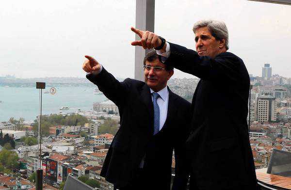 Turkish Foreign Minister Ahmet Davutoglu shows U.S. Secretary of State John F. Kerry the skyline of Istanbul before the start of a meeting in the Turkish city. (Hakan Goktepe / AFP/Getty Images / April 21, 2013)