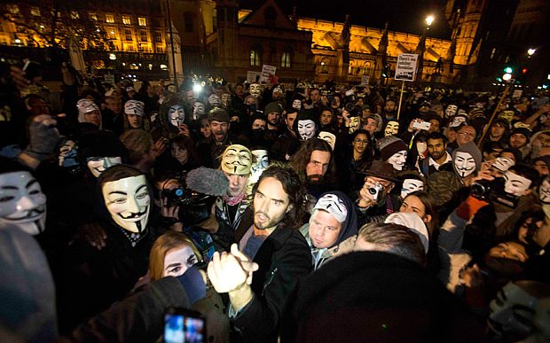 Masked protestors fire fireworks at the Houses of Parliament