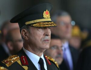 Turkey's new Chief of Staff Gen. Hulusi Akar stands at the mausoleum of Turkey's founder Mustafa Kemal Ataturk on Victory Day in Ankara, Turkey, Sunday, Aug. 30, 2015. Turkish army's 93-year-old victory over Greece was considered crucial in Turkish Independence War and the foundation of modern Turkish republic. (AP Photo/Burhan Ozbilici)